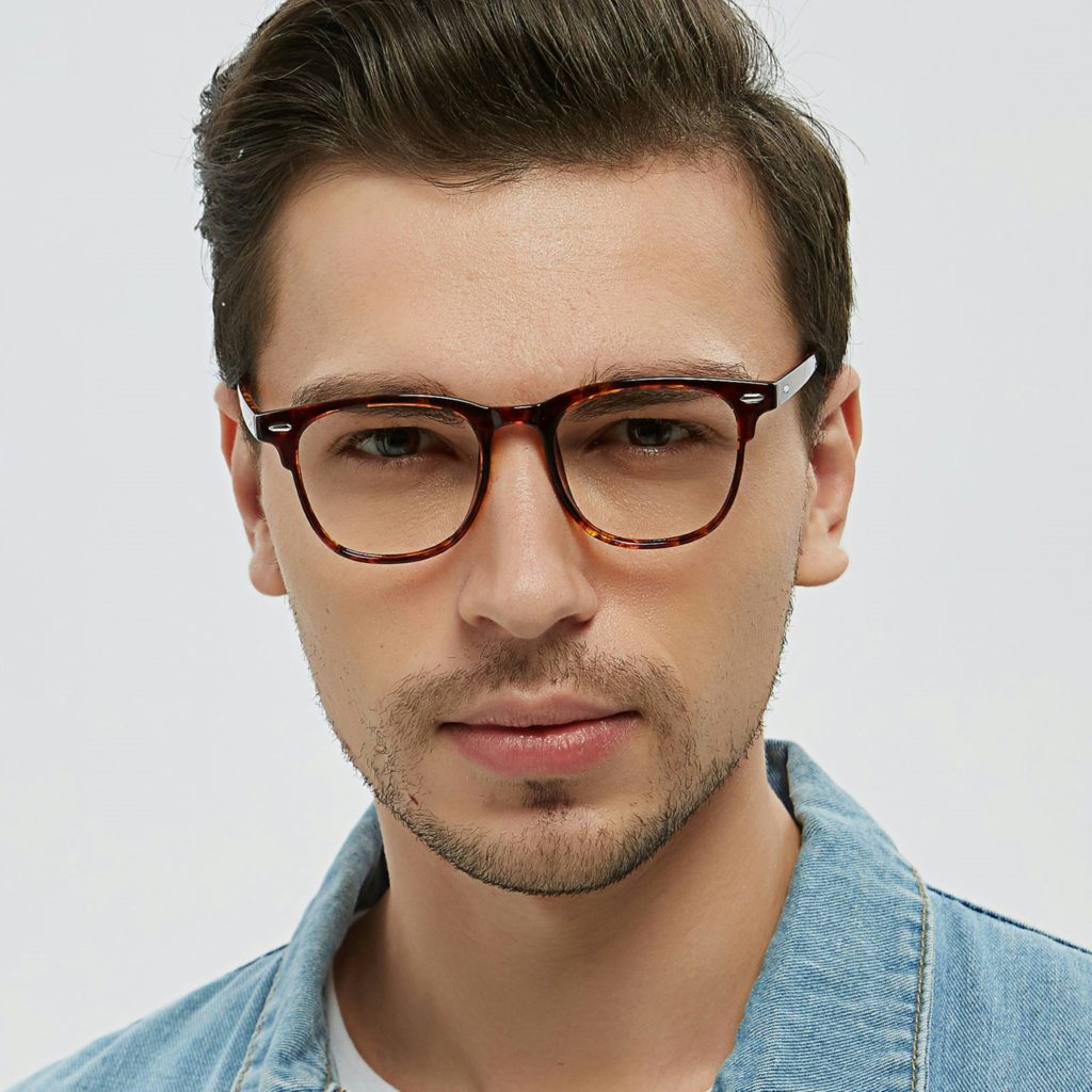 Man with large face in glasses